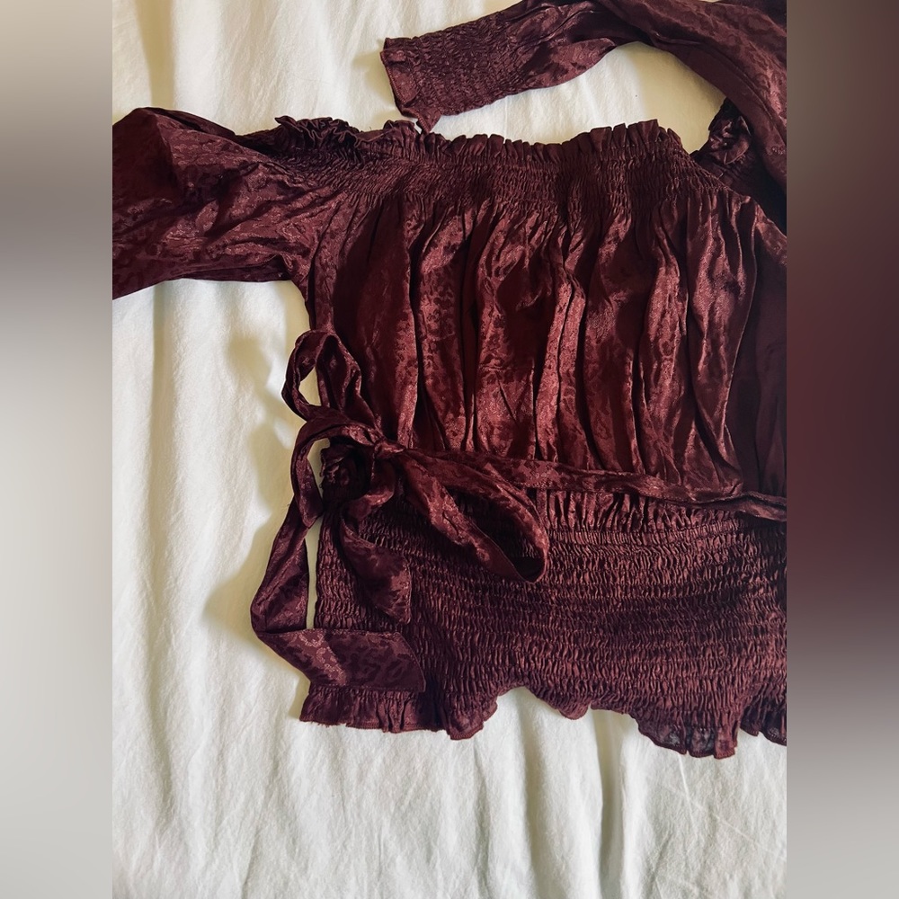 Maroon top. Medium.